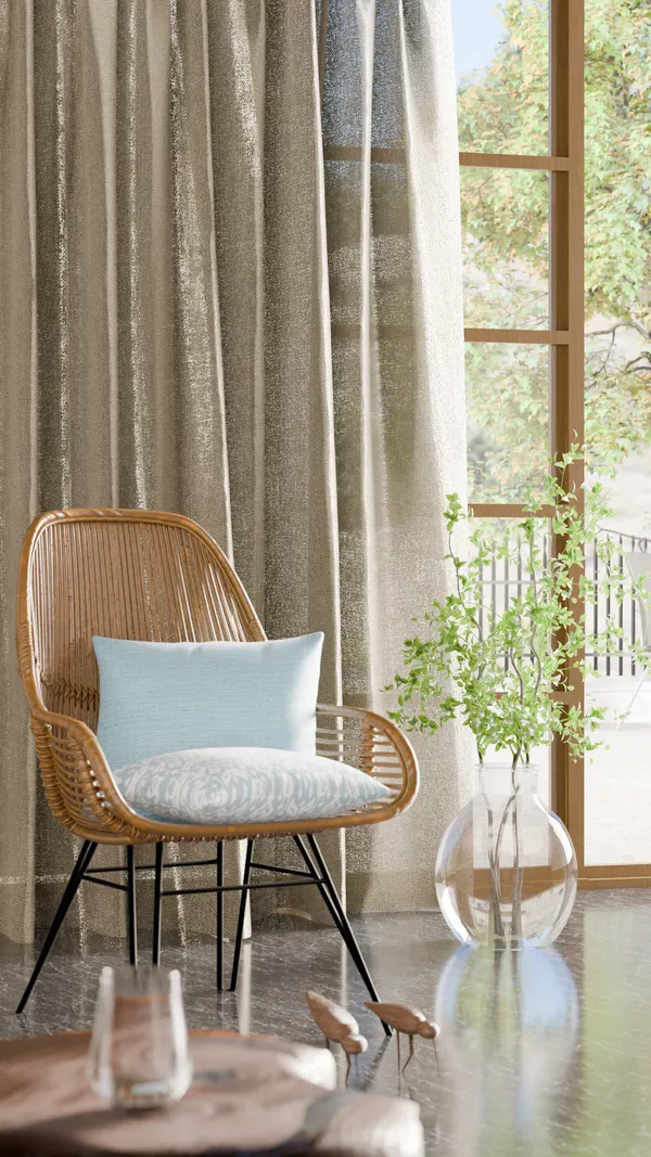 Wicker lounge chair by textured curtains and a sunlit window